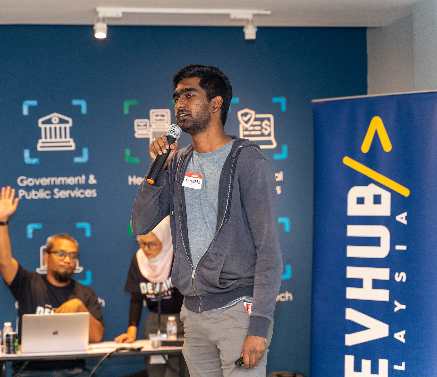 A speaker presenting during a DevHub Malaysia showcase session